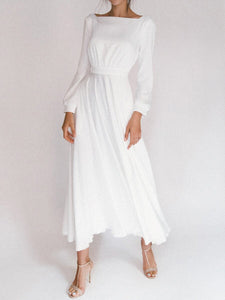 Vestido branco frente única com decote e manga comprida